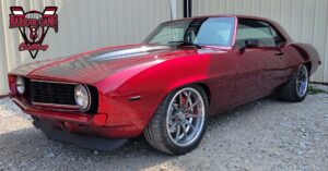 Custom red 1969 Camaro at Barker Gang shop