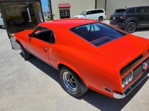 1969 Red Ford Mustang Mach 1 driver rear-end