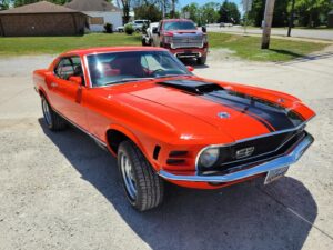 1969 Red Ford Mustang Mach 1 front-end passenger side