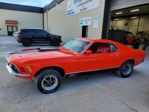 1969 Red Ford Mustang Mach 1 passenger side
