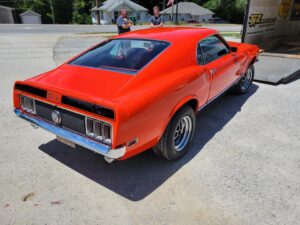 1969 Red Ford Mustang Mach 1 passenger rear-end