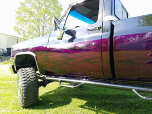 Purple 1977 GMC K20 door flames