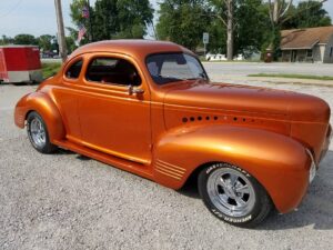 Orange classic car passenger side