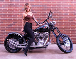 Magazine model on custom Harley Davidson motorcycle