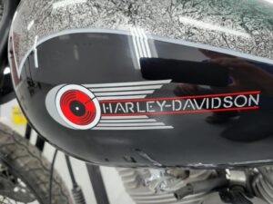Custom Harley Davidson gas tank with record player design close-up