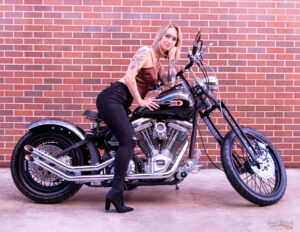 Magazine model on custom Harley Davidson motorcycle