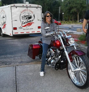 Foreigner's Kelly Hansen on Shriners Childrens' motorcycle at hospital