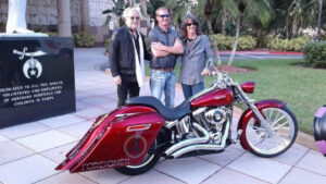 Shawn Barker with Kelly Hansen and Foreigner Shriners Childrens' motorcycle at hospital