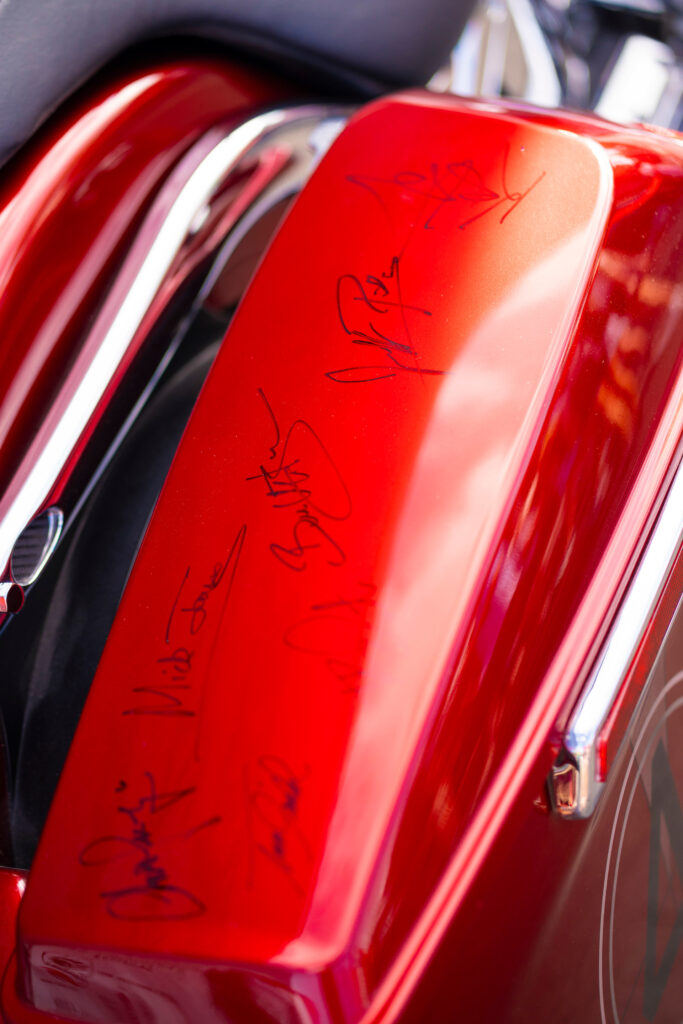 Shriners Children's motorcycle fender with Foreigner band signatures